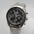Silver Seiko watch with black dial on a white background