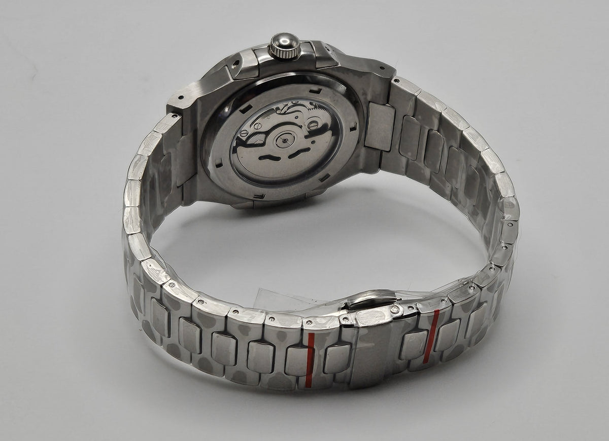 A custom Seiko Nautilus watch with a blue dial, stainless steel integrated bracelet, and a transparent case back displayed on a stand.