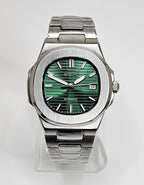 Silver Seiko watch with green face on a white background