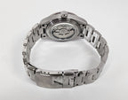 Silver watch with a detailed mechanism on a white background