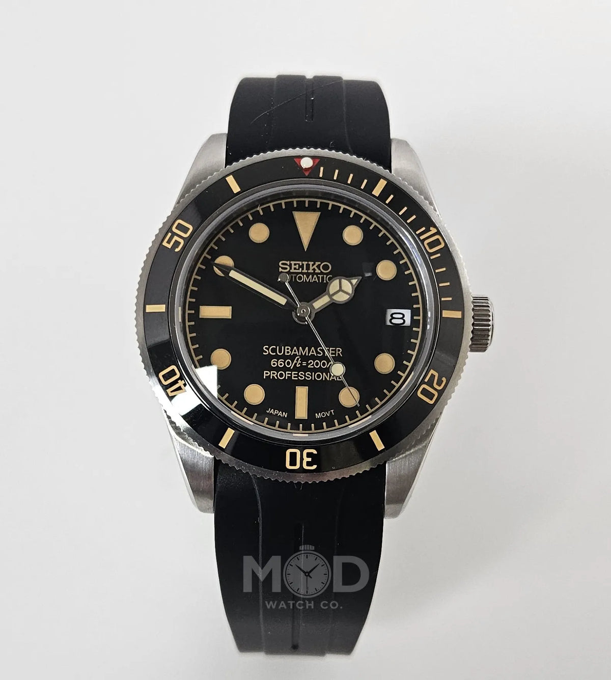 Seiko watch with black strap on a white background