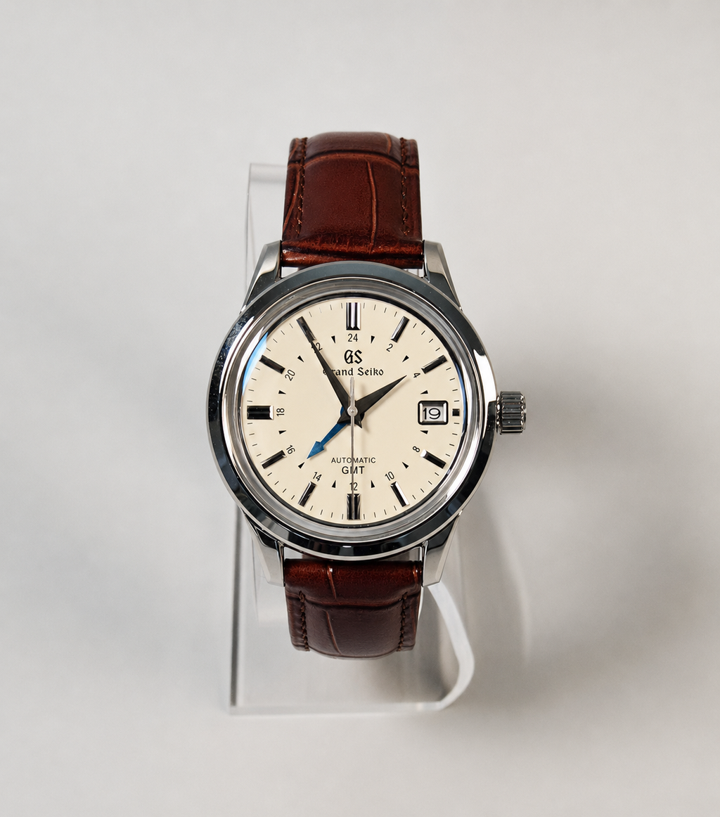 Wristwatch with brown leather strap on a white background