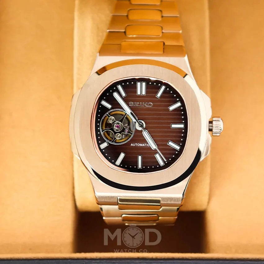 Gold Seiko watch with brown face on a matching background