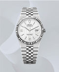 A Seiko stainless steel wristwatch with a fluted bezel, white textured dial, and matching steel link bracelet, shown against a light gray background with soft abstract wave shapes.