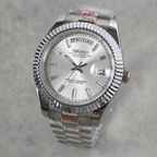 A Seiko Day-Specific wristwatch with a silver-tone stainless steel fluted bezel, silver dial, and matching steel link bracelet, shown on a light gray textured background.