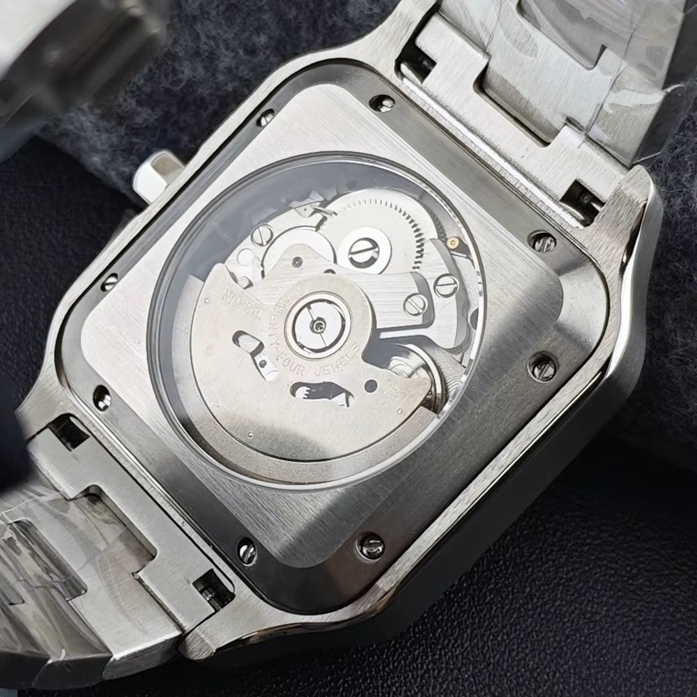 Close-up of a silver watch with a visible mechanical movement on a dark background