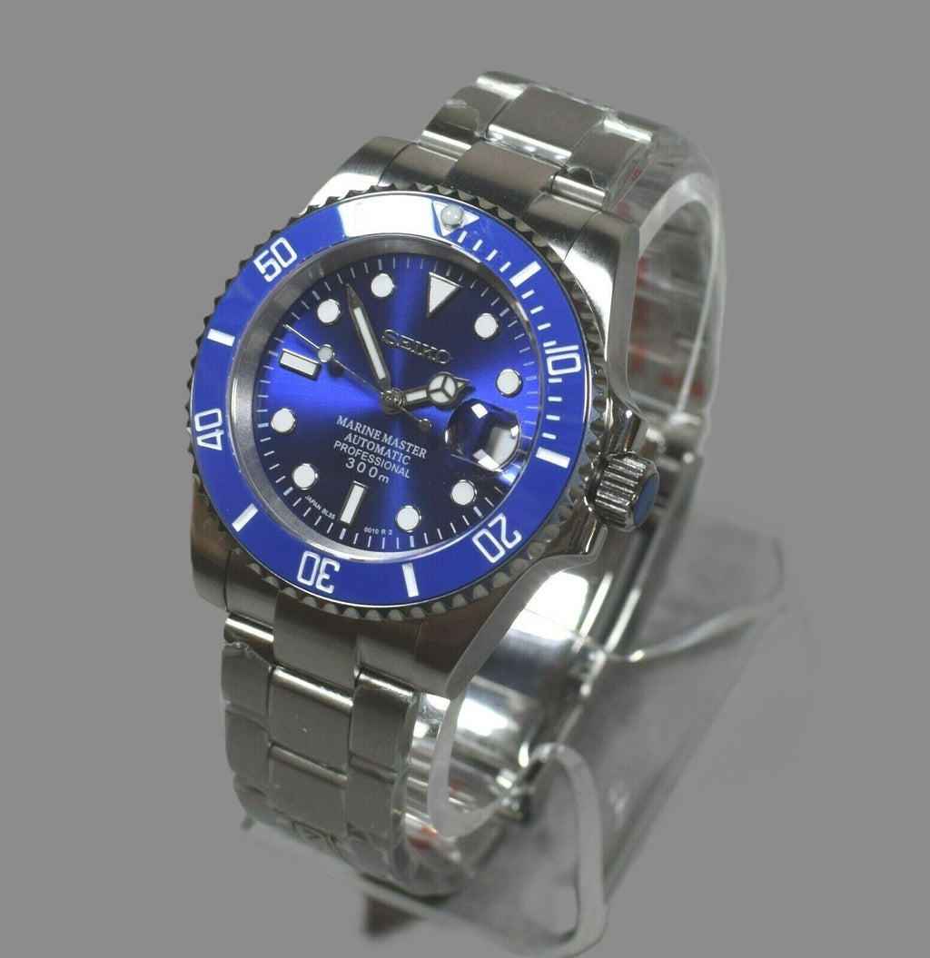 Silver watch with blue dial on a gray background