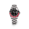 Seiko watch with black face and red bezel on a white background