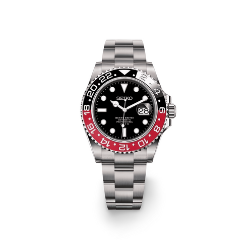 Seiko watch with black face and red bezel on a white background