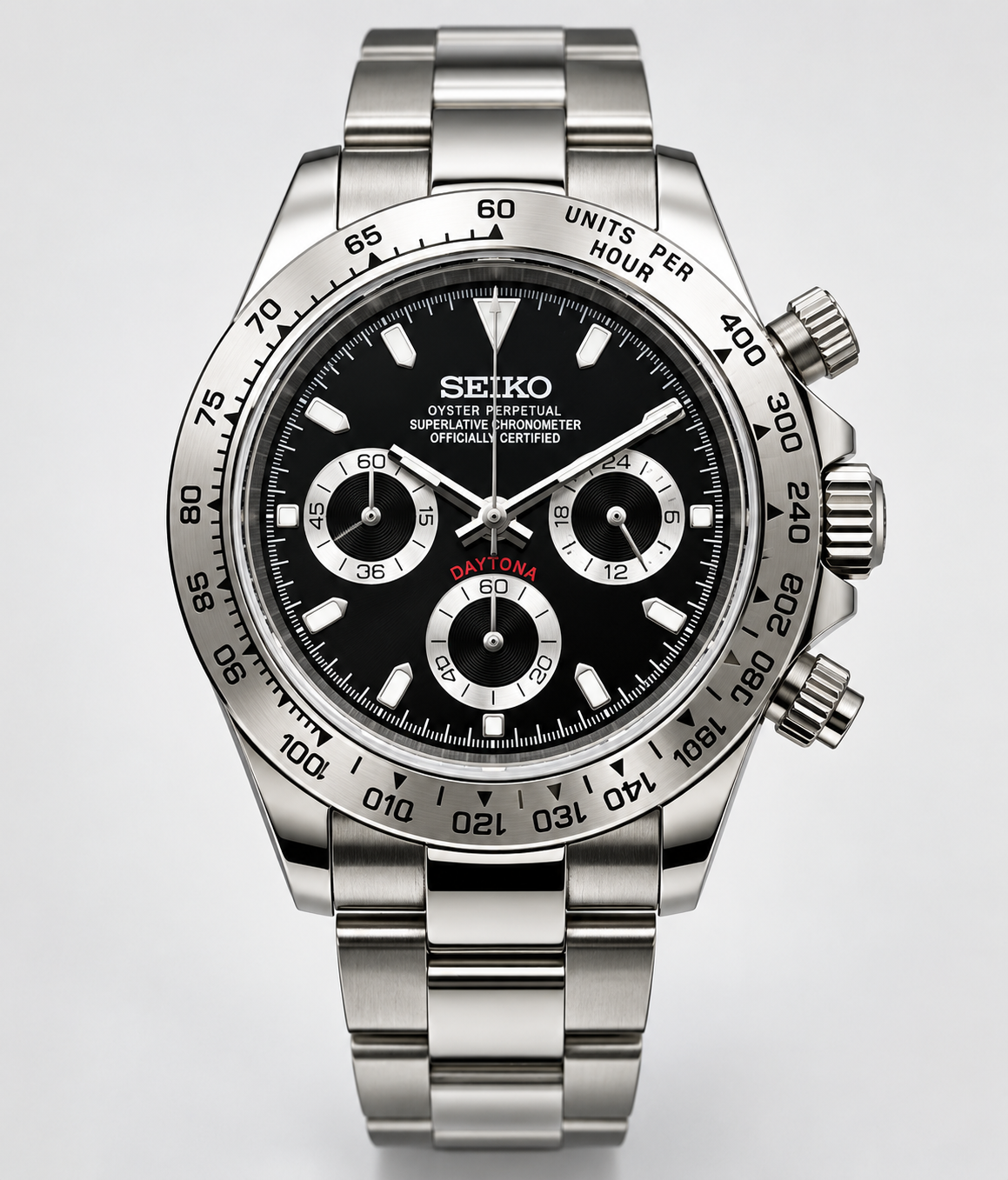 A Seiko stainless steel Daytona watch with a black dial, silver-tone metal bracelet, and a black tachymeter bezel, shown against a light gray background.