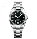 Seiko watch with black dial and silver metal strap on a white background